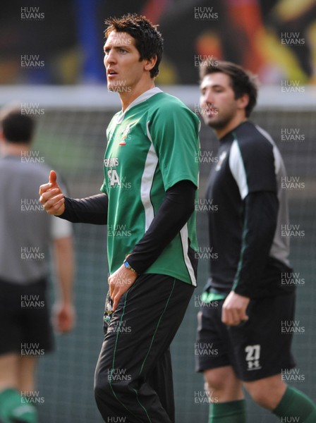 05.03.09 - Wales Rugby Training - James Hook and Gavin Henson look on during training. 