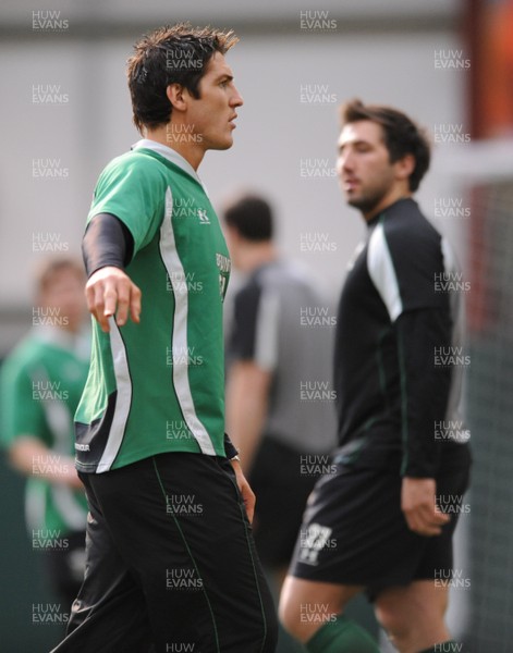 05.03.09 - Wales Rugby Training - James Hook and Gavin Henson look on during training. 