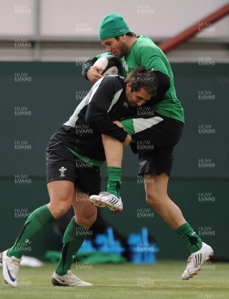 05.03.09 - Wales Rugby Training - Mike Phillips is tackled by Gavin Henson during training. 