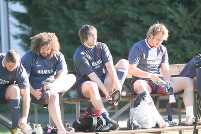05.06.08 Wales rugby in S.Africa... Wales captain Ryan Jones gets ready for training with Rhys Thomas, Adam Jones and Alun Wyn Jones at Bishop School in Cape Town.   
