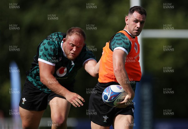 050923 - Wales Rugby Training in their first session in Versailles ahead of their opening Rugby World Cup game - Corey Domachowski and Tomos Williams during training
