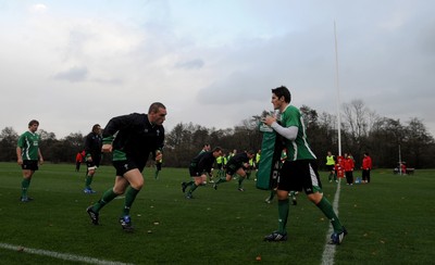 05.11.09 - Wales Rugby Training - Gethin Jenkins hits James Hooks tackle bag during training. 