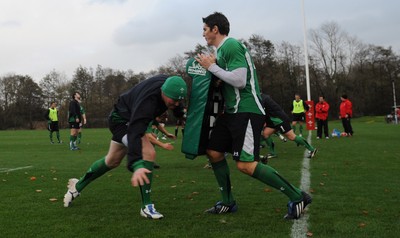 05.11.09 - Wales Rugby Training - Martyn Williams hits James Hooks tackle bag during training. 