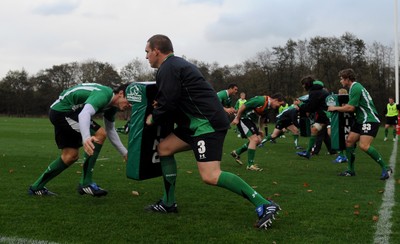 05.11.09 - Wales Rugby Training - James Hook hits Gethin Jenkins tackle bag during training. 