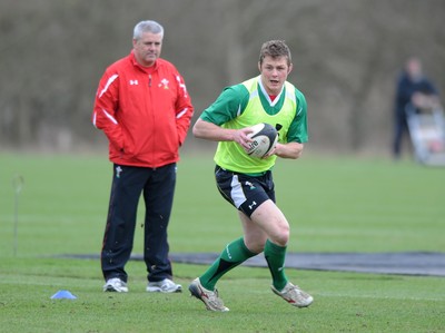 06.03.09 - Wales Rugby Training - Dafydd Jones is watched by head coach, Warren Gatland during training. 