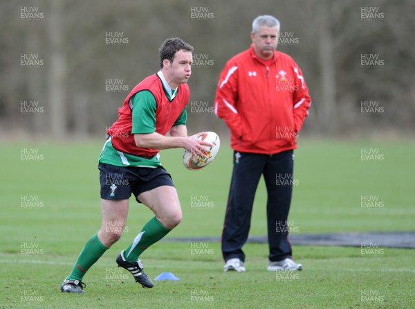 06.03.09 - Wales Rugby Training - Mark Jones is watched by head coach, Warren Gatland during training. 