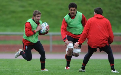 06.10.11 - Wales Rugby Training - Leigh Halfpenny takes on James Hook during training. 