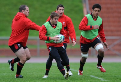 06.10.11 - Wales Rugby Training - Leigh Halfpenny takes on James Hook during training. 