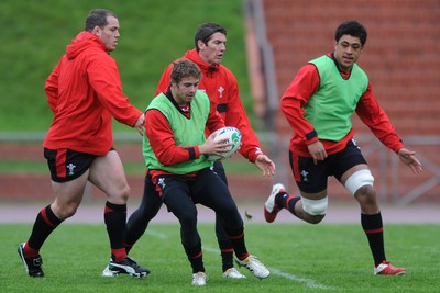 06.10.11 - Wales Rugby Training - Leigh Halfpenny takes on James Hook during training. 