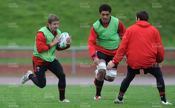 06.10.11 - Wales Rugby Training - Leigh Halfpenny takes on James Hook during training. 