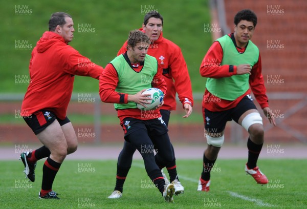 06.10.11 - Wales Rugby Training - Leigh Halfpenny takes on James Hook during training. 