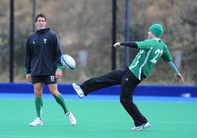 07.02.09 - Wales Rugby Training - Stephen Jones kicks the ball as James Hook looks on during training. 