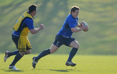07.03.11 - Wales Rugby Training - Jonathan Davies is tackled by Rob McCusker during training. 