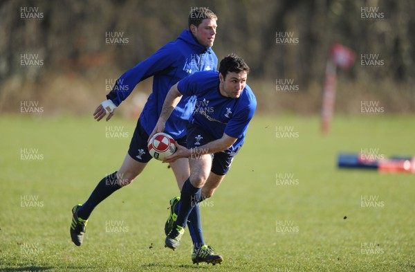 07.03.11 - Wales Rugby Training - Stephen Jones is tackled by Rhys Priestland during training. 