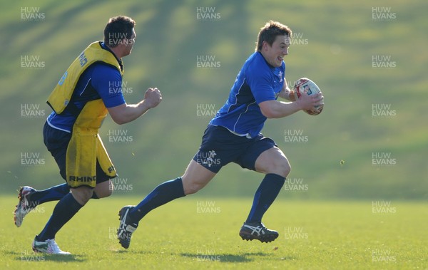 07.03.11 - Wales Rugby Training - Jonathan Davies is tackled by Rob McCusker during training. 