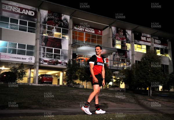 070612 - Wales Rugby Training -Sam Warburton walks past a poster of James Horwill and Will Genia during training