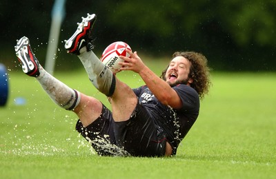 07.08.07 - Wales Rugby Training - Adam Jones enjoys the rain during training 