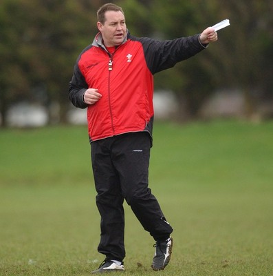 080203 - Wales Rugby Training - Welsh Coach Steve Hansen looks on as team train