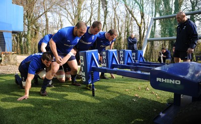 08.03.11 - Wales Rugby Training - (L-R) Sam Warburton, Craig Mitchell, Matthew Rees and Paul James pack down on the scrum machine during training. 