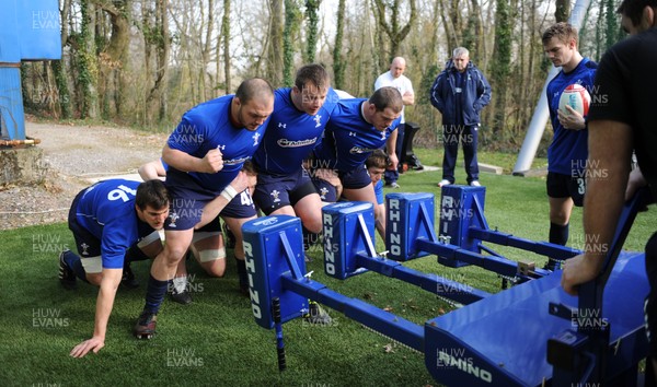 08.03.11 - Wales Rugby Training - (L-R) Sam Warburton, Craig Mitchell, Matthew Rees and Paul James pack down on the scrum machine during training. 