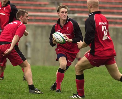 080601 - Wales Rugby Training - Jamie Robinson takes on Adrian Durston and Nathan Budgett in training at the Hanazono Stadium in Osaka