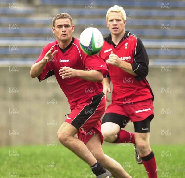 080601 - Wales Rugby Training - Adrian Durston concentrates while watched by Jamie Ringer at the Hanazono Stadium in Osaka