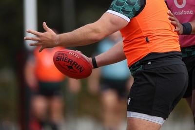 080724 - Wales Rugby enjoy a quick game of Aussie Rules Football in Training in the week ahead of their second test against Australia in Melbourne - Kemsley Mathias during training