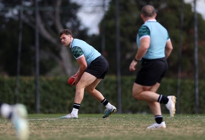 080724 - Wales Rugby enjoy a quick game of Aussie Rules Football in Training in the week ahead of their second test against Australia in Melbourne - Mason Grady during training