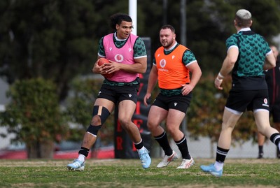 080724 - Wales Rugby enjoy a quick game of Aussie Rules Football in Training in the week ahead of their second test against Australia in Melbourne - Mackenzie Martin during training