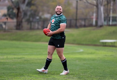 080724 - Wales Rugby enjoy a quick game of Aussie Rules Football in Training in the week ahead of their second test against Australia in Melbourne - Harri O�Connor during training