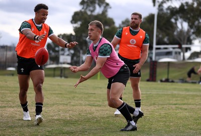 080724 - Wales Rugby enjoy a quick game of Aussie Rules Football in Training in the week ahead of their second test against Australia in Melbourne - Cameron Winnett during training