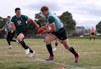 080724 - Wales Rugby enjoy a quick game of Aussie Rules Football in Training in the week ahead of their second test against Australia in Melbourne - Jacob Beetham during training