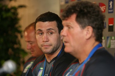 08.09.07 Wales World Cup training... Stephen Jones watches Coach Gareth Jenkins speaking at a press conference at the ground in Nantes. 