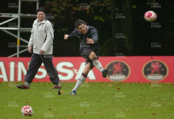 08.11.06 - Wales Rugby Training - Wales Kicking Coach, Neil Jenkins looks on as James Hook takes a kick 
