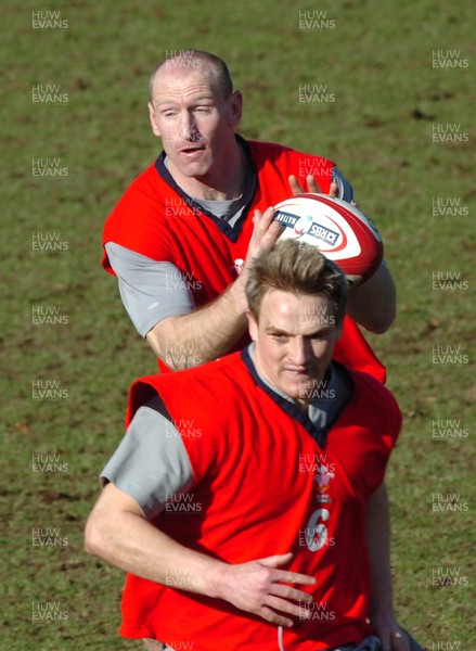 090206  Wales rugby training, Cardiff - Gareth Thomas receives the ball behind Matthew Watkins   