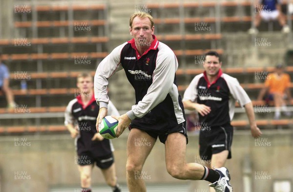090601 - Wales Rugby Training - Gareth Thomas watched by Dwayne Peel and Stephen Jones