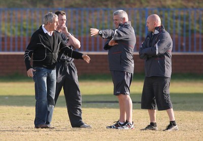 09.06.08 Wales rugby in South Africa... Warren Gatland ,Rob Howley and Shaun Edwards chat with Ian McGeechan during training in Pretoria.  