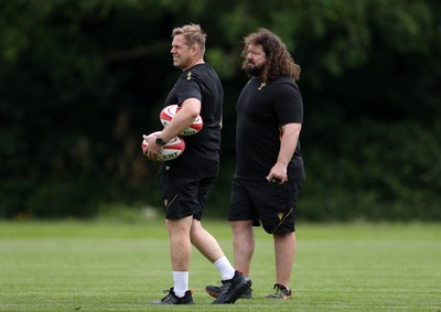 090625 - Wales Rugby Training - T Rhys Thomas, Assistant Forwards Coach and Adam Jones, Scrum Coach during training