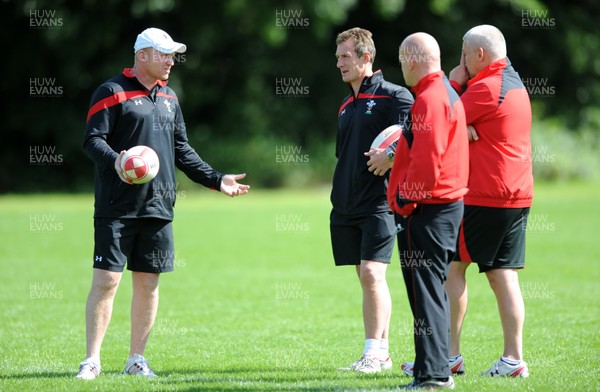 09.08.11 - Wales Rugby Training - Head coach Warren Gatland(R) talks to his assistants Neil Jenkins, Shaun Edwards and Rob Howley during training. 