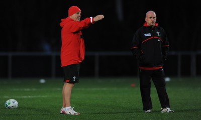 09.09.11 - Wales Rugby Training - Head coach Warren Gatland(L) talks to defence coach Shaun Edwards during training. 