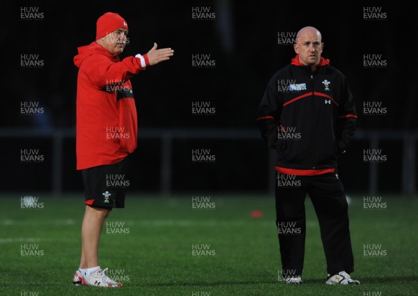 09.09.11 - Wales Rugby Training - Head coach Warren Gatland(L) talks to defence coach Shaun Edwards during training. 