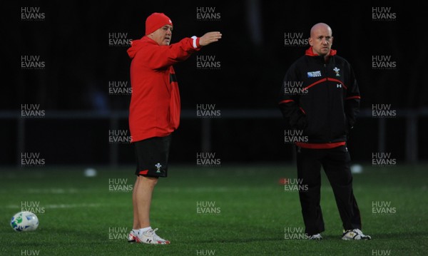09.09.11 - Wales Rugby Training - Head coach Warren Gatland(L) talks to defence coach Shaun Edwards during training. 