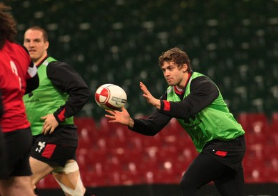 100212 Wales Squad Training - RBS 6 Nations Championship- Wales' Leigh Halfpenny runs onto a pass in training