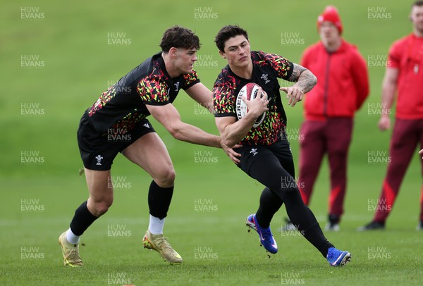 100326 - Wales Rugby Training ahead of their final Six Nations game against Italy - Eddie James and Louis Rees-Zammit during training