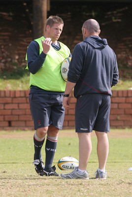 10.06.08 Wales rugby in South Africa... Rhys Thomas discusses tactics with forwards coach Robin McBryde in training.  