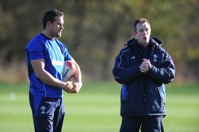 10.11.10 - Wales Rugby Training - Lee Byrne listens to attack coach Rob Howley during training. 