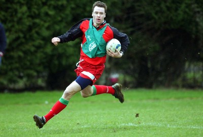 110203 - Wales Rugby Training - Wales and Llanelli winger Mark Jones at full stretch as he trains