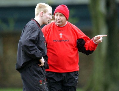 110203 - Wales Rugby Training - Wales coach Steve Hansen gives Tom Shanklin a few pointers during training