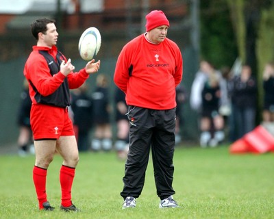 110203 - Wales Rugby Training - Wales scrum-half Gareth Cooper and coach Steve Hansen pictured during training