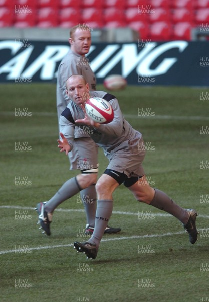 110206  Wales rugby training,Cardiff Gareth Thomas receives the ball watched by Martyn Williams at the Millennium Stadium   